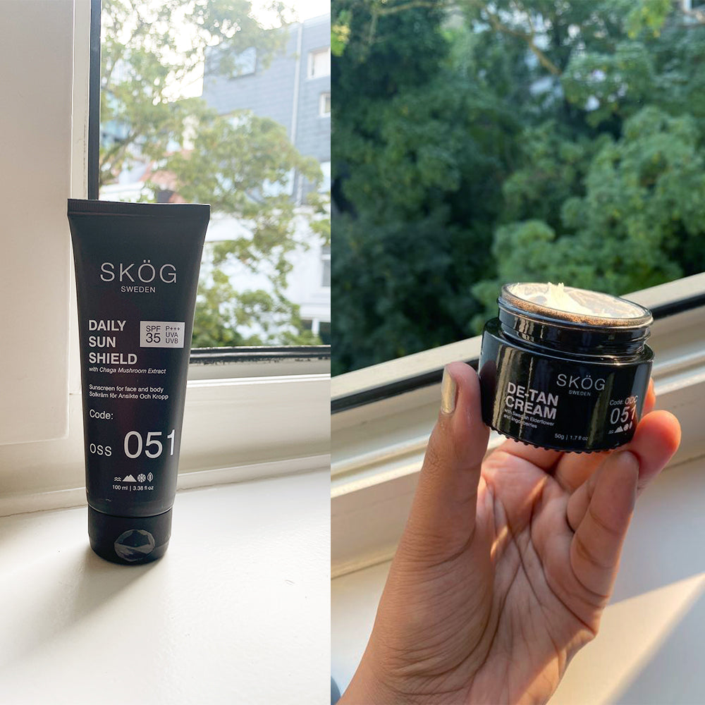 Summer combo Skog The Summer Combo protects you from Uv rays contains Daily Sun Shield, De- tan cream. Front black squeezy ,glass container open back window tree   