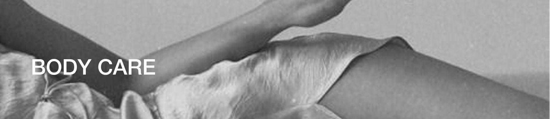 Woman lean side ways body care were written black and white photo